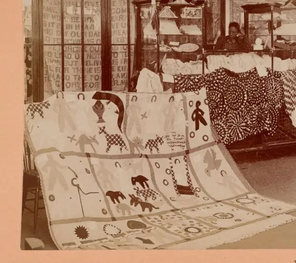 Quilt exhibit, interior of Negro building, Atlanta Exposition