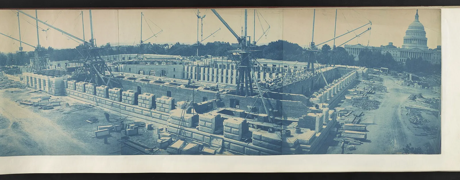 Library of Congress (Thomas Jefferson Building): Builders at work on the rusticated stone walls of the Library of Congress Thomas Jefferson Building during its construction; U.S. Capitol in the background LCCN2013645934