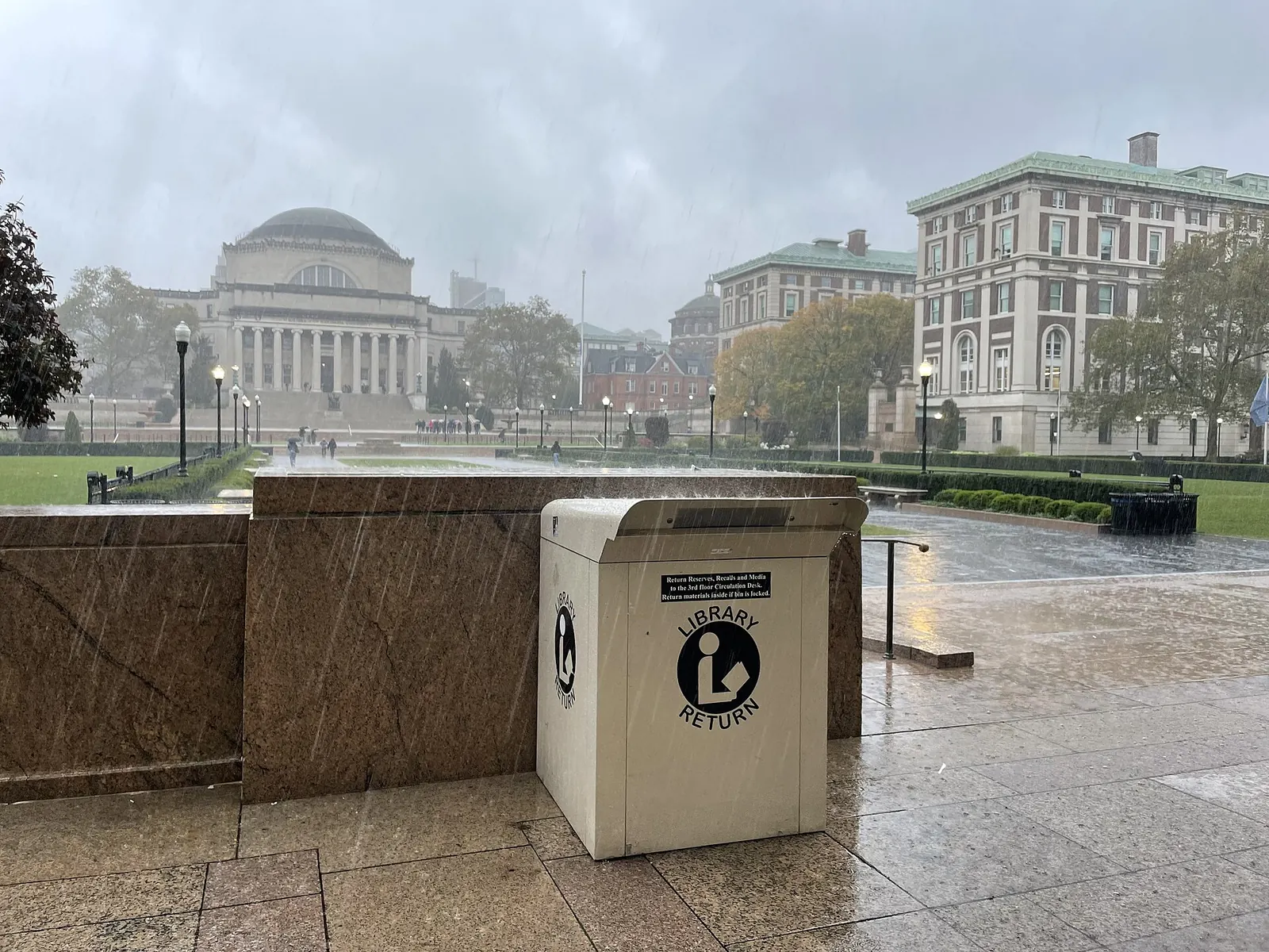 Low Memorial Library: 10292023 Columbia quad book drop rain