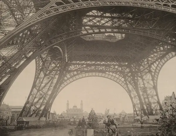 Beneath the Eiffel Tower, before the ascent