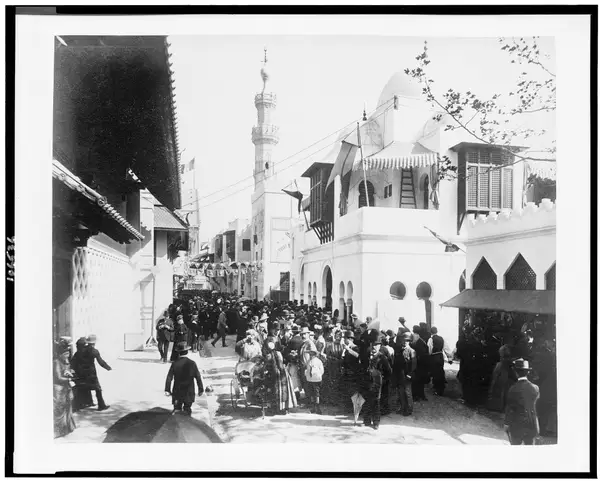 Crowd on "a street in Cairo" in front of the Pavilions of Morocco, Paris Exposition, 1889