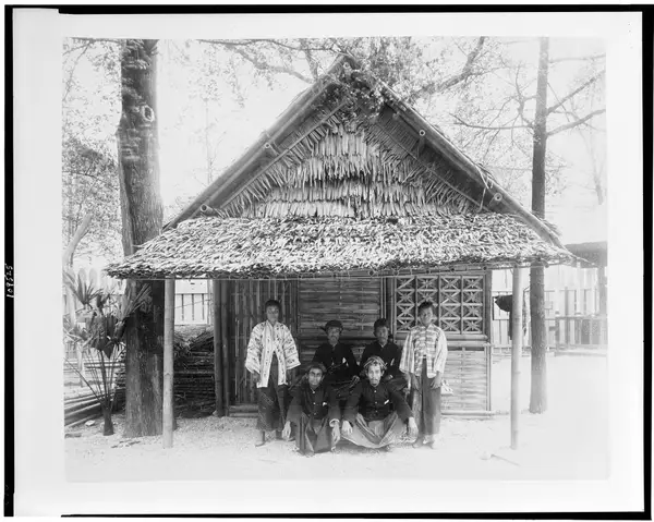 Six people posed before Javanese house in Javanese Village, Paris Exposition, 1889