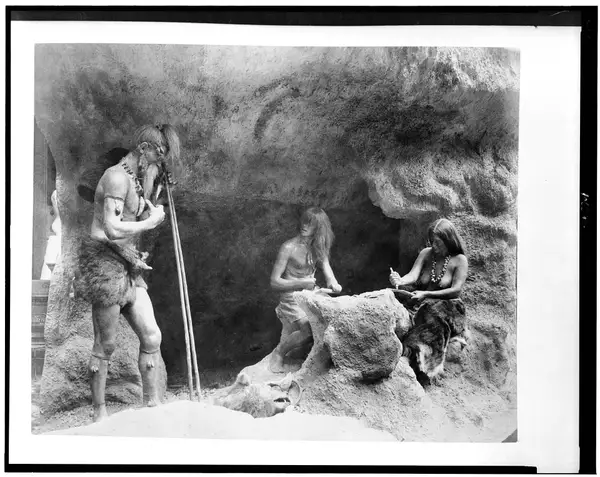 Diorama in the History of Work exhibit showing Stone Age people making flint instruments, Paris Exposition, 1889