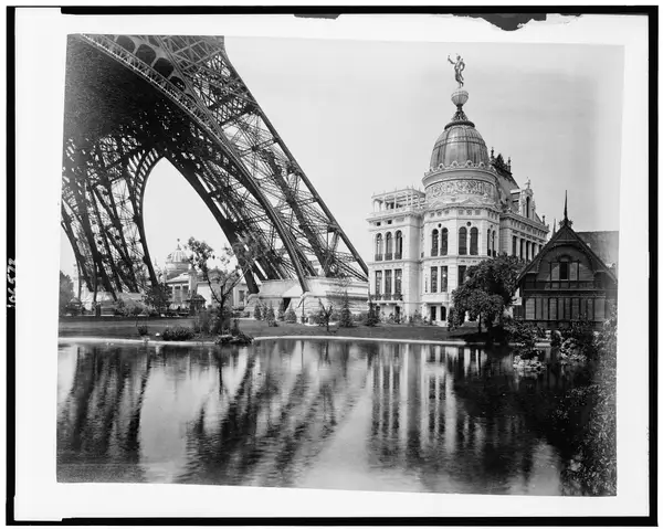 Gas Pavilion and Swedish chalet at right, section of Eiffel Tower at left, Paris Exposition, 1889