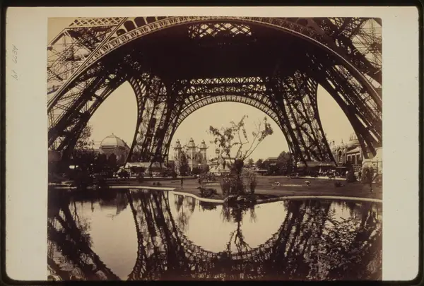 Exhibit buildings and grounds seen through the lower part of the Eiffel Tower, Paris Exposition, 1889